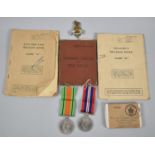 A Vintage Royal Windsor Tin Containing WWII Medals, Soldiers Service and Pay Book, Soldiers Relief