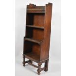 An Edwardian Oak Waterfall Bookcase with Three Open Shelves and Galleried Top, 44cms Wide