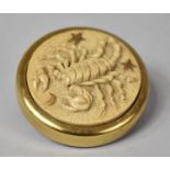 A Brass Based Circular paperweight decorated in relief with Astrological Scorpion, 6cms Diameter