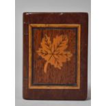 A Small Wooden Puzzle Box or Vesta in the Form of a Book with Inlaid Maple Leaf to Front Cover,