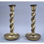 A Pair of Gilt Sprayed Oak Barley Twist Candlesticks, 25cm high