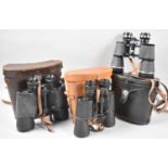 A Collection of Three Leather Cased Pairs of Binoculars