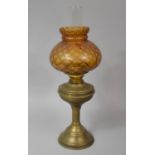 A Brass Oil Lamp with Amber Glass Shade, Double Controls, 55cm high