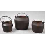 A Graduated Set of Three Cast Iron Metal Cauldrons with Inner Liners, Largest 15cm high