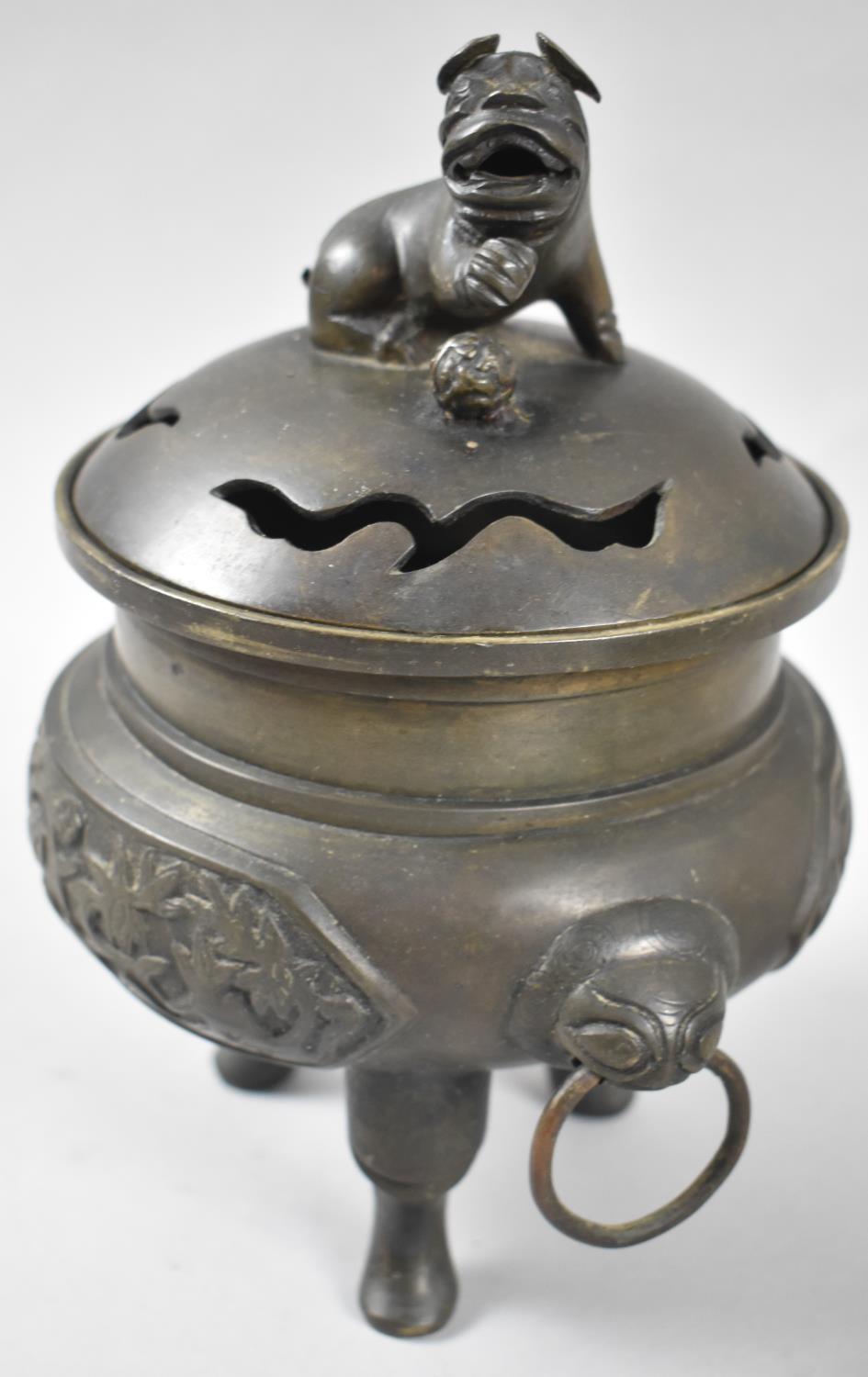 A Bronze Incense Burner Supported on Tri Supports the Body Having Twin Ring Handles with Temple Lion - Image 2 of 3