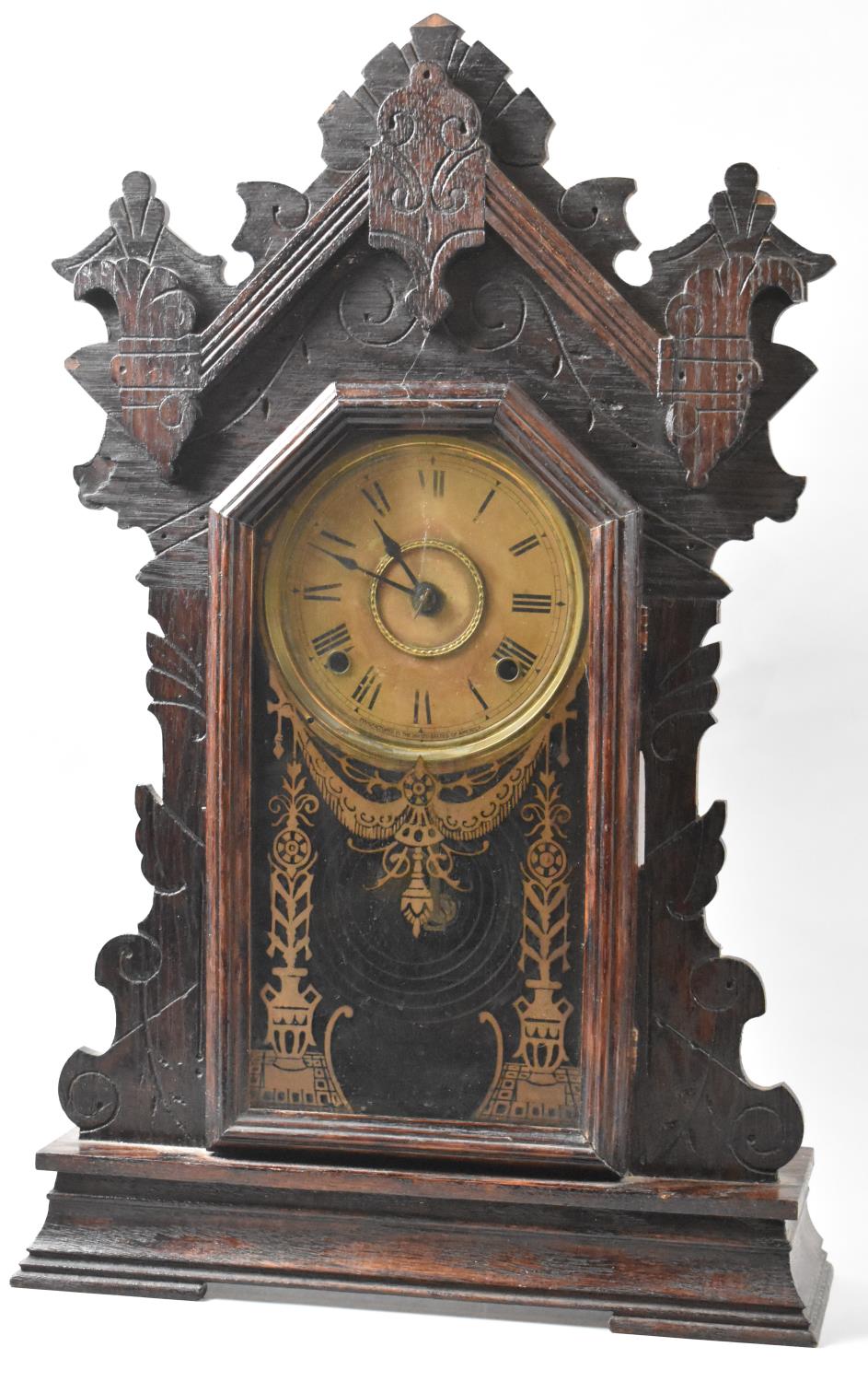 A Late 19th/Early 20th Century American Gingerbread Clock with Eight Day Movement, 58cm high