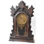 A Late 19th/Early 20th Century American Gingerbread Clock with Eight Day Movement, 58cm high