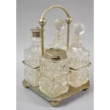 An Edwardian Four Bottle Cruet Set in Silver Plate and Glass