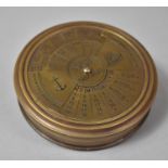 A Reproduction Brass Circular Compass and Hundred Year Calendar, 8cm Diameter