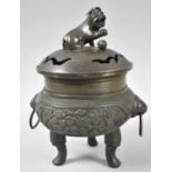 A Bronze Incense Burner Supported on Tri Supports the Body Having Twin Ring Handles with Temple Lion