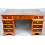 A Mid 20th Century Kneehole Desk with Three Tooled Leather Panels to Top, Centre Long Drawer Flanked