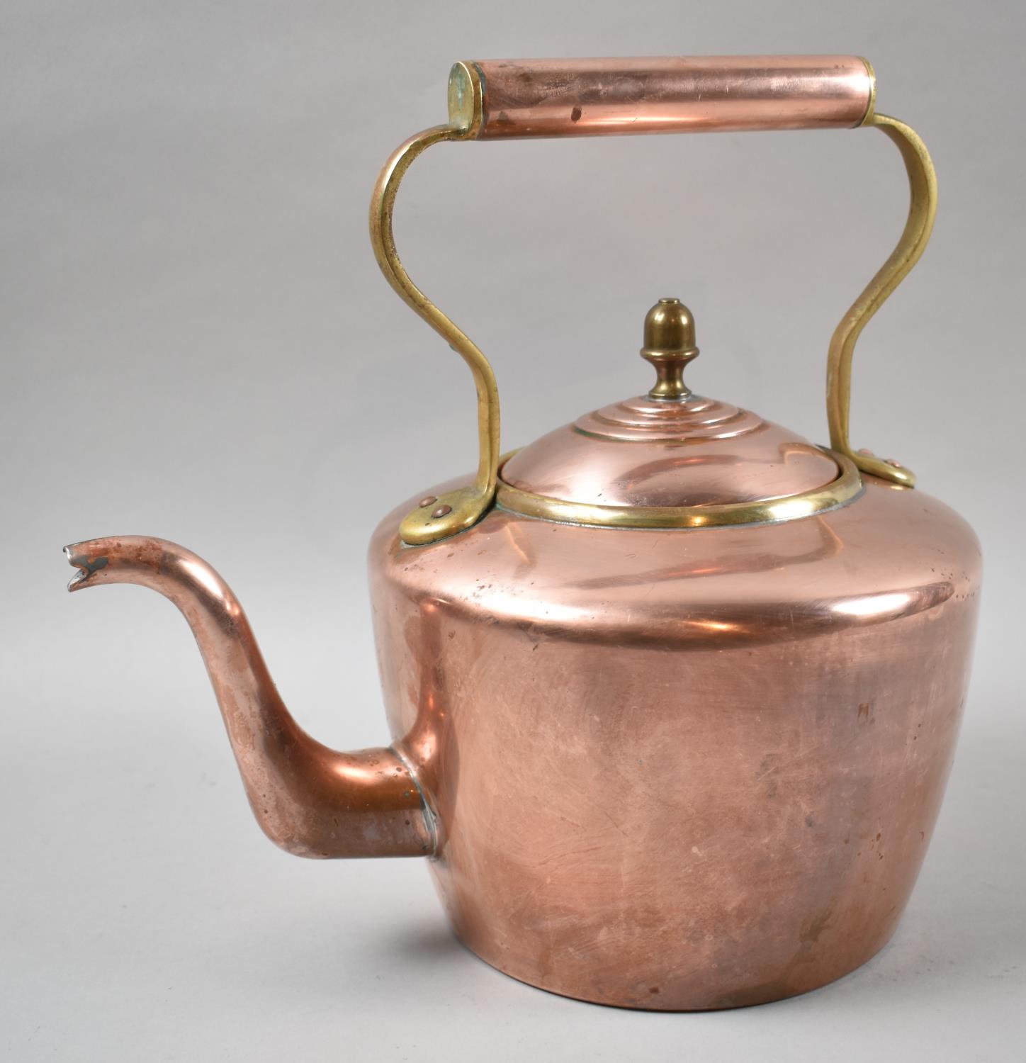 A Mid 20th Century Copper and Brass Kettle, 30cm high