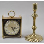 A Late Victorian Brass Candlestick, 22cm high Together with a Modern Brass Cased Carriage Clock with