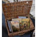 A Wicker Hamper Containing Children's Annuals