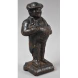 A Late 19th Century Cast Iron Model of a Portly Gentleman Carrying Book, Possibly Pickwick and