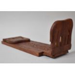An African Carved Wooden Souivern Bookslide the Hinged Ends in the Form of Elephants, 33cm Wide