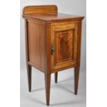 An Edwardian Inlaid Walnut Bedside Cabinet with Galleried Top, Panelled Door and Square Tapering