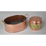 An Oval Copper Pan with Brass Handles and a Copper and Brass Biscuit Barrel