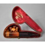 A Cased Carved Meerschaum Pipe Decorated with Three Pug Dogs and Amber Mouthpiece