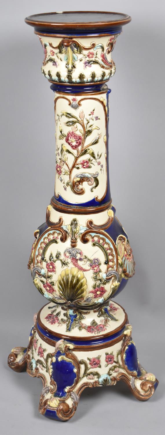 A Continental Majolica Jardiniere Stand with Moulded Shell Decoration In Multicoloured Enamels, Some