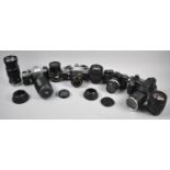 A Collection of Various Vintage 35mm Cameras and Telescopic Lens