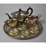 A Silver Plated Three Piece Tea Set together with Circular Tray and Four Coasters