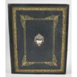 A Late Victorian/Edwardian Desktop Blotter Case with Tooled Gilded Decoration and White Metal Mount,