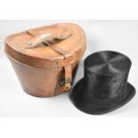 A Nice Quality Leather Hat Box Containing a Small Silk Top Hat by Christy's of London, Inner