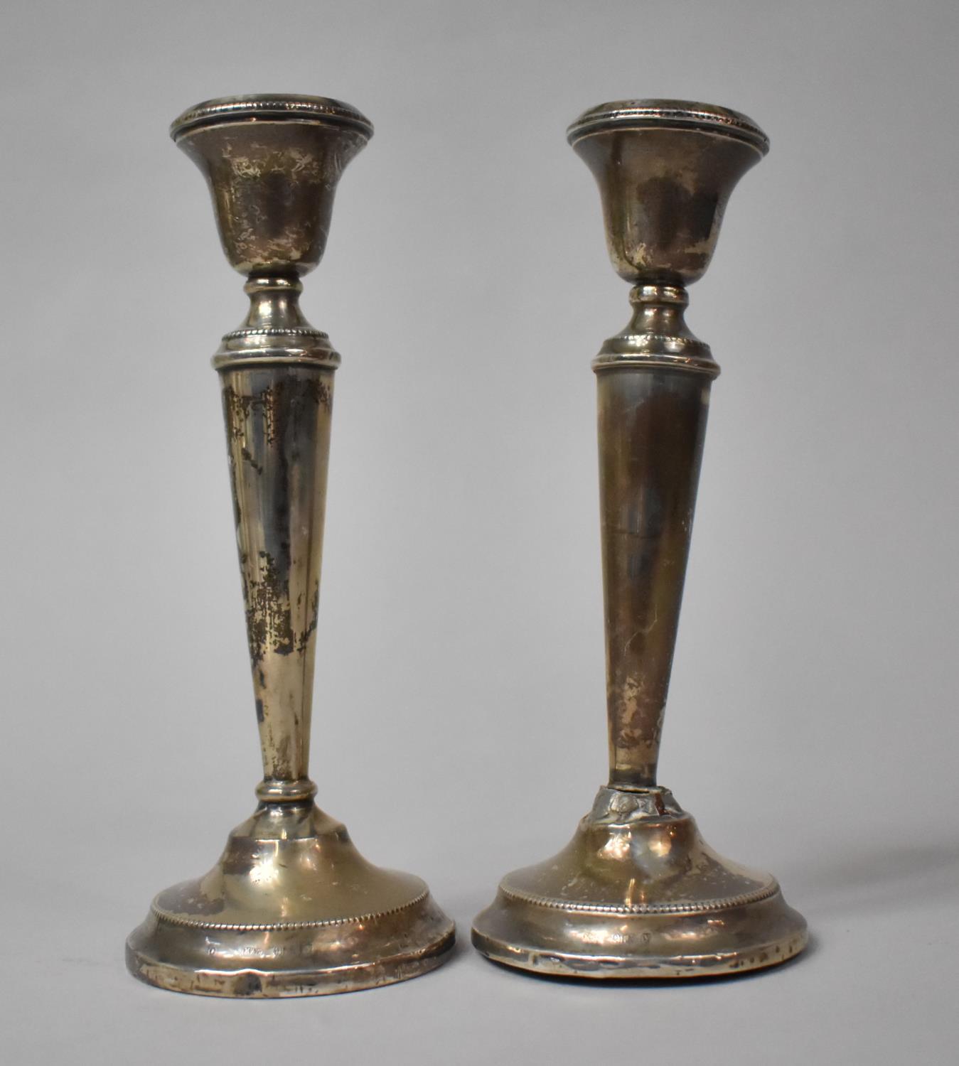 A Pair of Silver Candlesticks, Birmingham Hallmark, 18cm high, Both with Varying Condition Issues