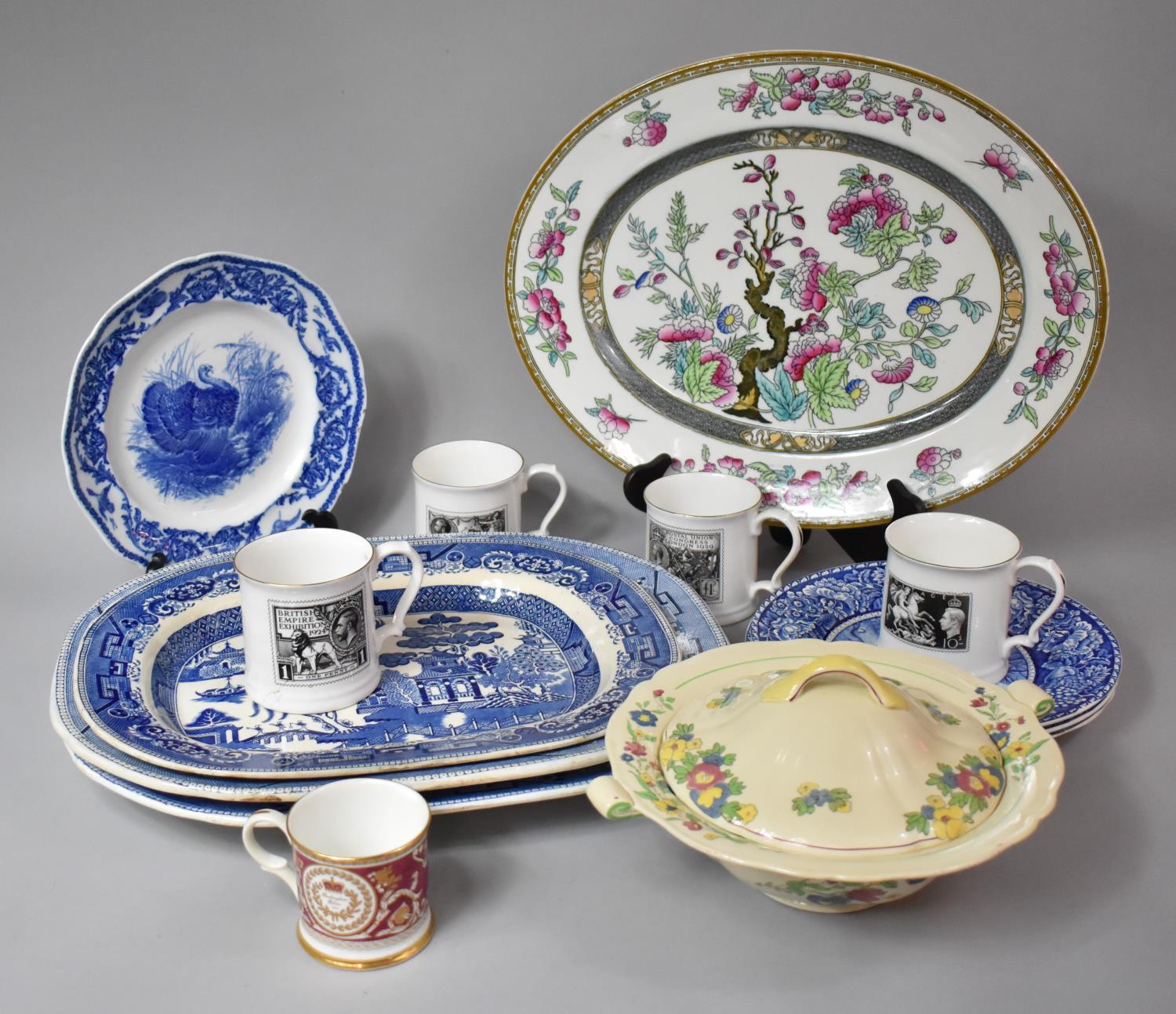 A Collection of Four Various Meat Plates to include Three Blue and White Willow Pattern Examples and