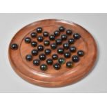 A Modern Wooden Circular Solitaire Board Containing Coloured Glass Marbles, 22cm Diameter