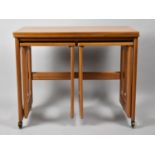 A 1970's Fold Over Teak Trolley Table as a Nest with Two Smaller Tables, 74cm wide