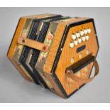An Eastern German Hexagonal Accordion with 21 Buttons by BM, Leather Carrying Strap