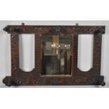 An Edwardian Carved Oak wall Hanging Hall Mirror with Five Coat Hooks, 82cm Wide