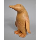 A Carved Wooden Study of a Penguin by Dcuk, 22cm high