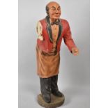 A Large Fibreglass and Composition Figural Dumb Waiter, Lost One Arm and Tray, 93cm high