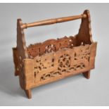 A Carved and Pierced Far Eastern Magazine Rack, 38cm wide