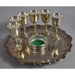 A Silver Plated Shaped Circular Tray on Shaped Scrolled Supports together with a Set of Six