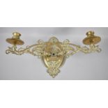 An Art Nouveau Brass Wall Fixing Two Branch Candelabra with Pierced Scrolled Supports, 22cm high