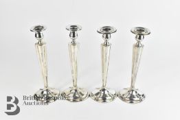Four Silver Candlesticks