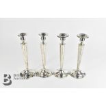 Four Silver Candlesticks