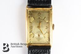 Vintage gentleman's 14ct Tissot wrist watch. The watch having a gilded face with numeric dial with