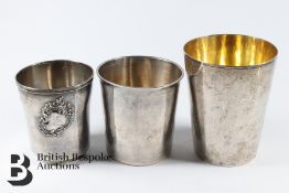 Three White Metal Beakers