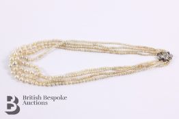 Four Strand Set of Pearls with Diamond Clasp