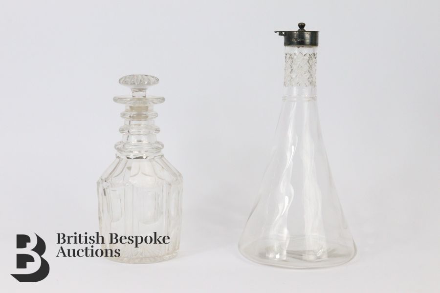 Silver Topped Glass Decanter and One Other