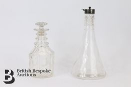 Silver Topped Glass Decanter and One Other
