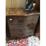 A VINTAGE MAHOGANY SERPENTINE FRONTED FOUR DRAWER CHEST