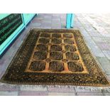 A VINTAGE AFGHAN WOOL RUG/CARPET 292 X 202CM