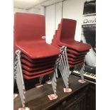 TWELVE RED PLASTIC SCHOOL STACKABLE CHAIRS