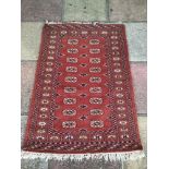 A VINTAGE PRAYER RUG 118 X 81CM